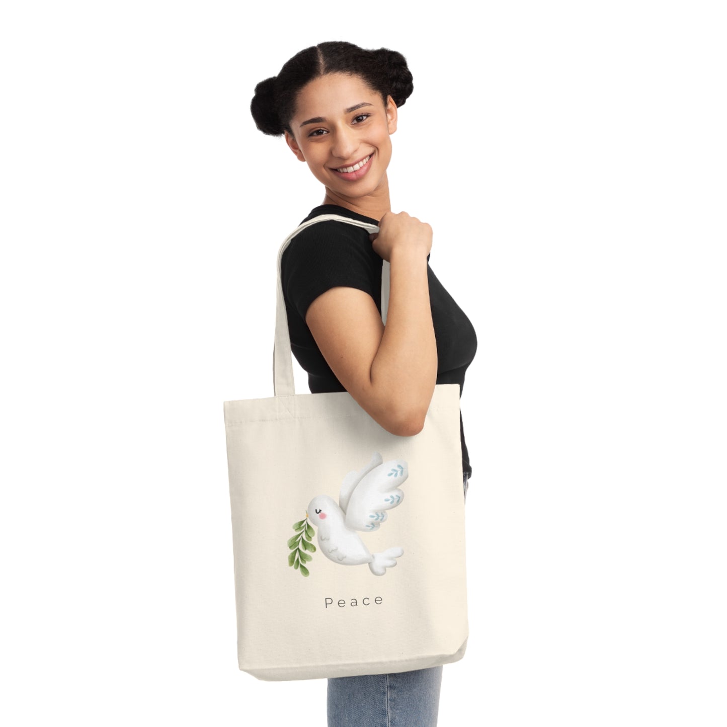Cream-colored tote bag with a soft watercolor dove carrying olive leaves, above the word “Peace” in minimalist font.